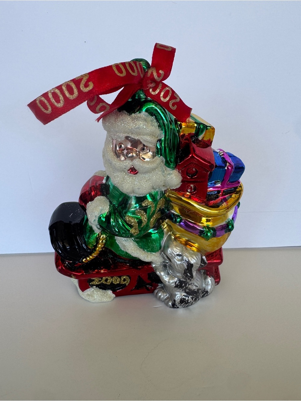 Holiday Santa Ornament with Green Coat and Multicolor Gifts